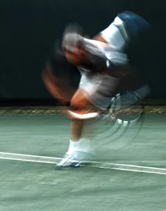 Athlete in motion with blue blur.
