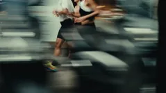 Close-up athlete at the far edge of the carousel.